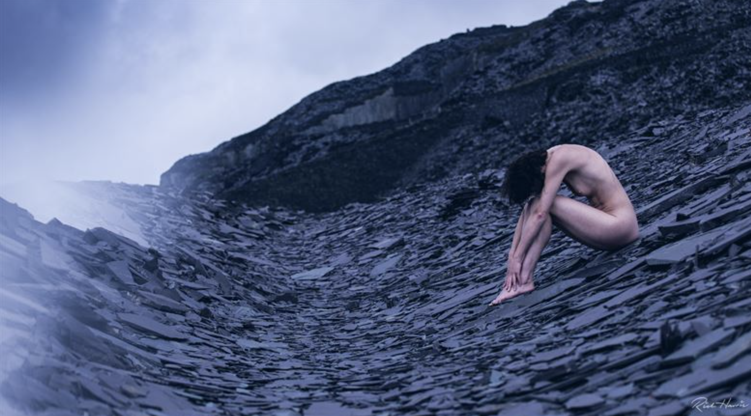 Abstract silhouette of human body blended with recycled materials texture.